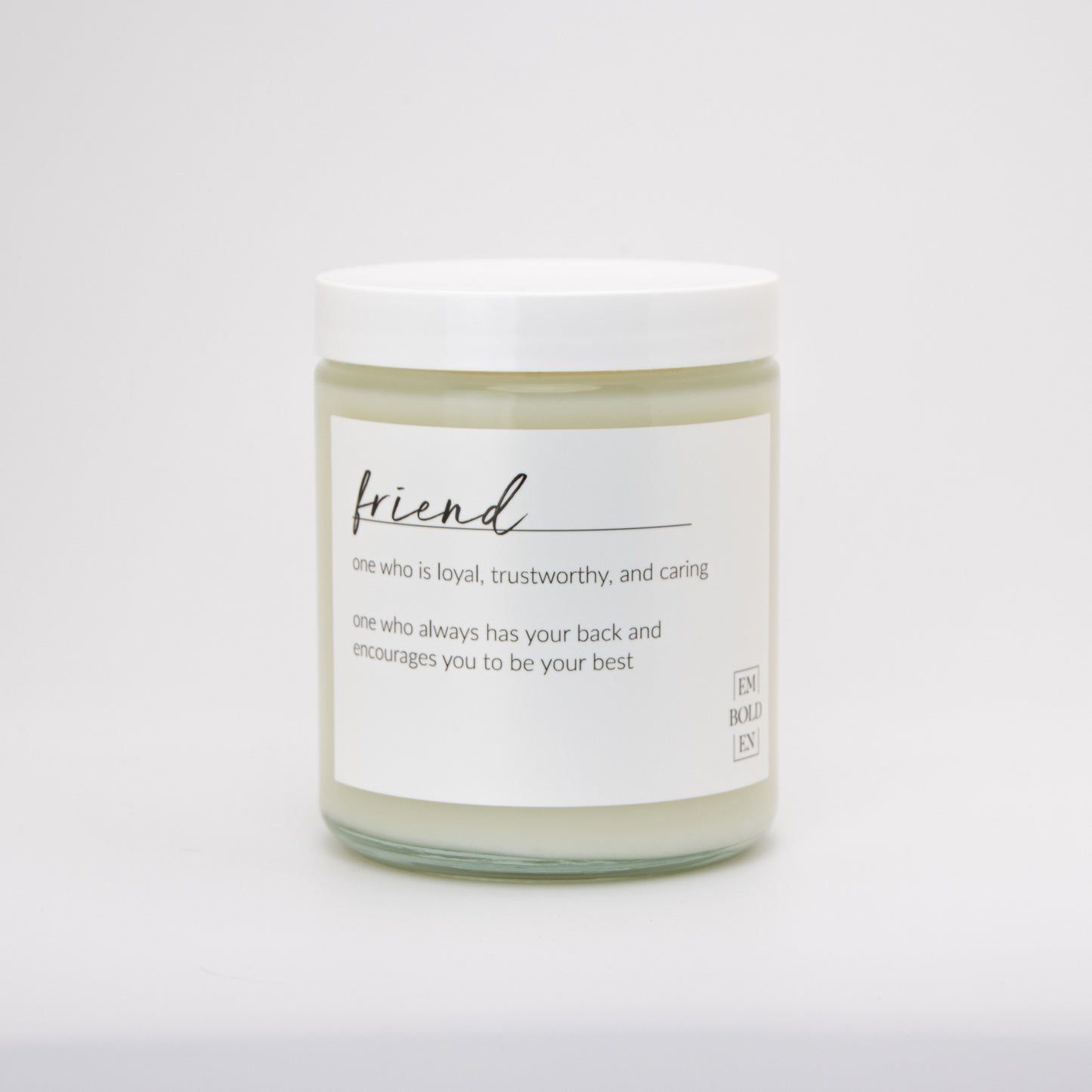 Hand-poured soy wax candle named 'Friend' with a warm, inviting scent in a clear glass jar.