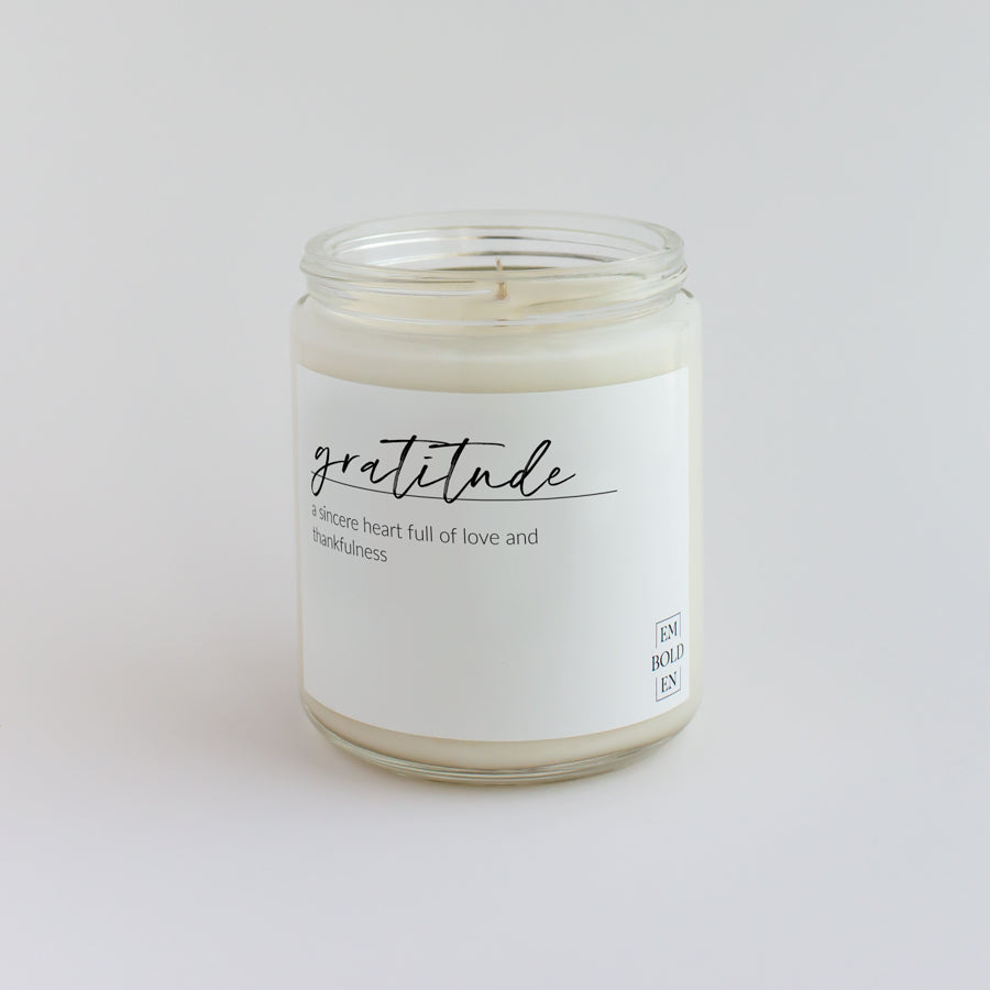 'Gratitude' scented candle in a clear jar, designed to inspire thankfulness and joy.